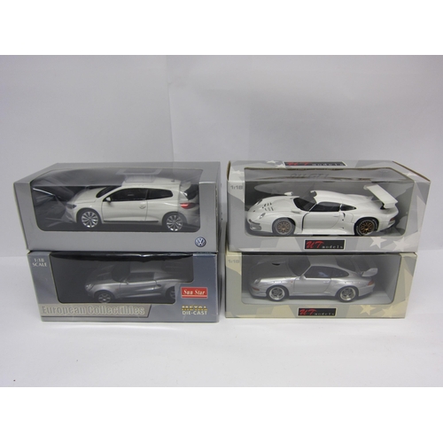 9221 - Four boxed 1:18 scale diecast cars to include UT Models Porsche 911 GT1 and GT2, Sun Star Lotus Elis... 