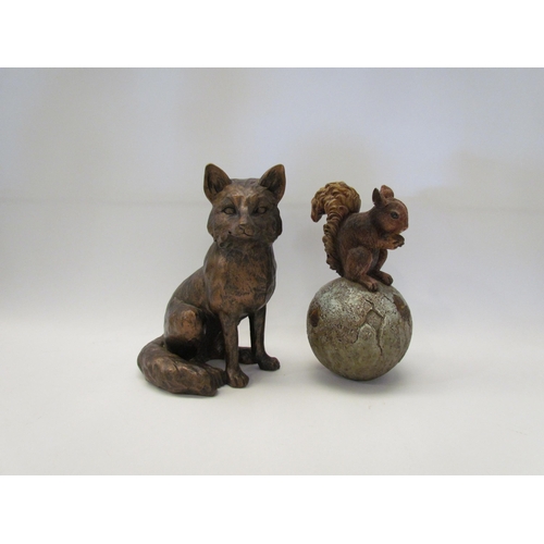 1284 - A bronzed effect figure of a seated fox, 20.5cm tall, and a squirrel on a ball with acorns, 20cm tal... 