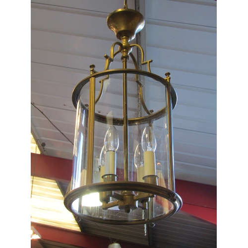 1482 - A pair of Georgian style brass pendant lights with curved glass shades