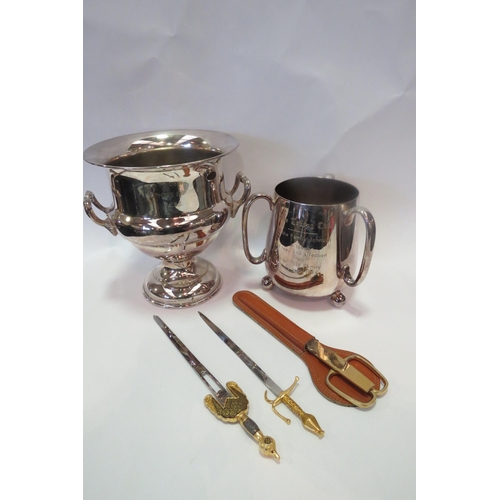 1254 - A selection of coinage, sword form letter openers, a silver plated tyg and ice bucket