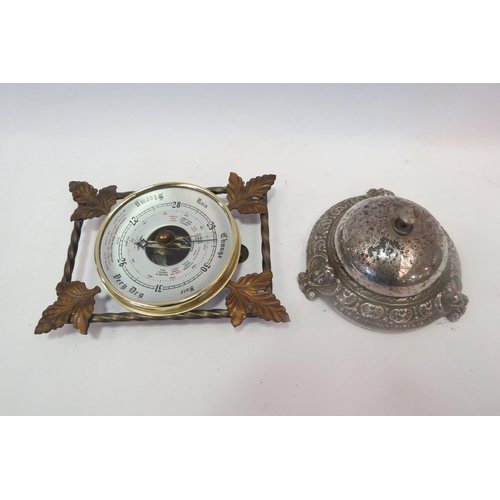 1335 - A white metal shop bell and a wall hanging barometer