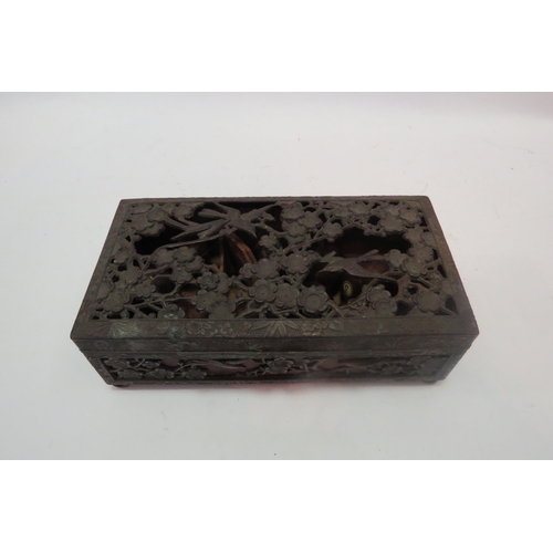 1341 - A Japanese metal box decorated with birds and prunus containing miniature bowls