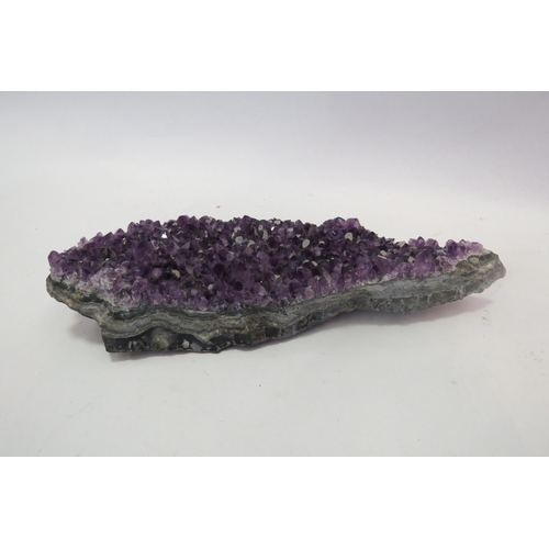 1348 - An amethyst crystal, 26cm long