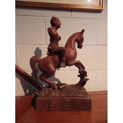 1005 - A carved Oriental figure on horseback, a/f, 52cm tall