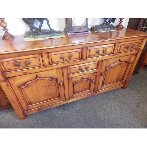 1015 - A fruitwood (cherry) sideboard, four short drawers over central single drawer and cupboard flanked b... 