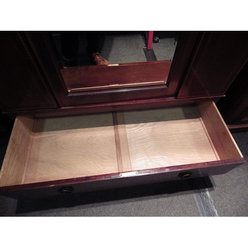 1026 - An Edwardian inlaid mahogany bevel edged mirror single door wardrobe with two keys over a single dra... 
