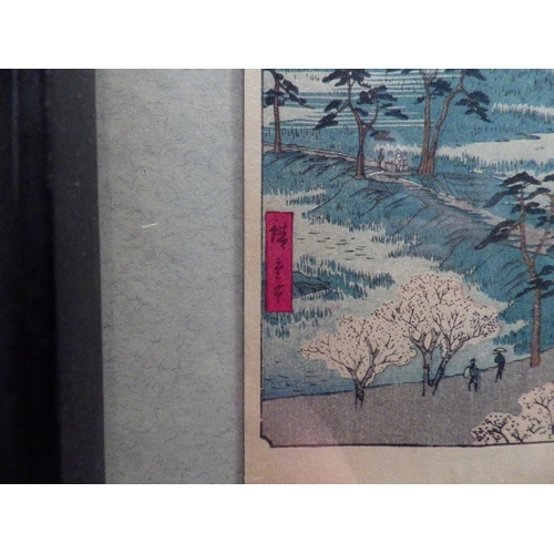1043 - Two framed and glazed displays of Japanese landscape postcards including bridge scene, 57cm x 57cm i... 