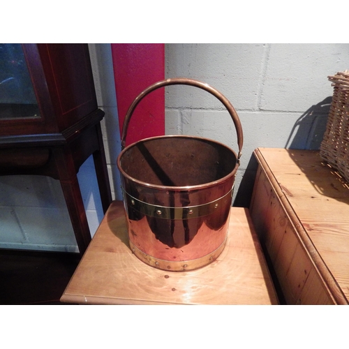 1074 - A copper brass bound coal bucket, stud detail