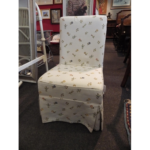 1083 - A nursery chair with beige floral upholstery