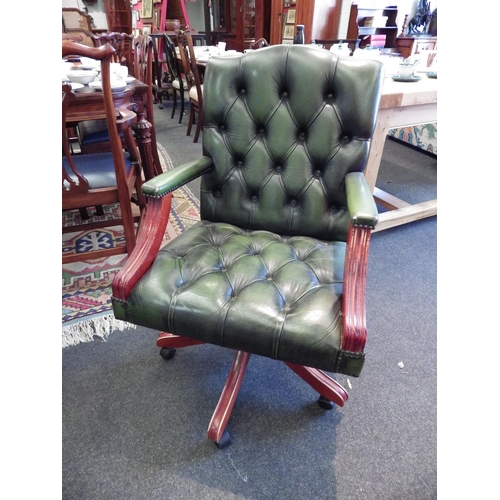 1088 - A green leather button-back and seat swivel office chair