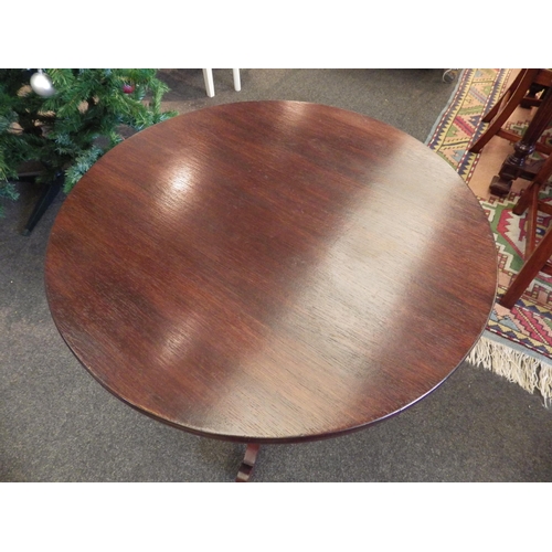 1090 - A mahogany wine table, turned column, tripod outswept legs, 73cm tall x 59cm diameter