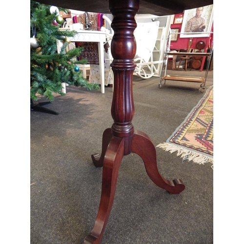 1090 - A mahogany wine table, turned column, tripod outswept legs, 73cm tall x 59cm diameter