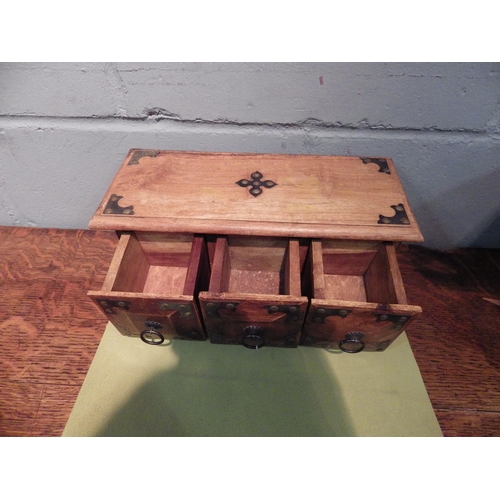 1107 - A small set of three wooden drawers, 15cm tall x 34cm long x 14.5cm deep