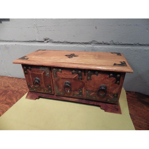 1107 - A small set of three wooden drawers, 15cm tall x 34cm long x 14.5cm deep