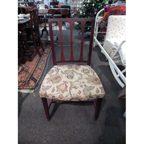 1124 - A 19th Century mahogany chair, wide over-stuffed seat, later upholstered, raised on square tapering ... 