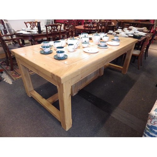 1142 - An oak refectory style table joined by 