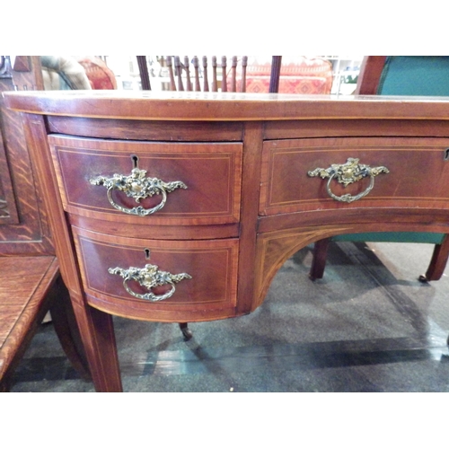 1152 - A mahogany veneer kidney shaped dressing table and stool, some fading to top