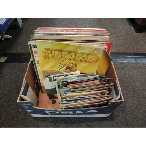 1174 - A box of LP's and 45rpm records to include Elvis Golden Records LP, Beatles 45's The Beatles Million... 