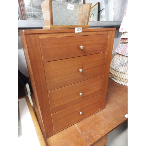 2414 - A teak bedside chest of four drawers