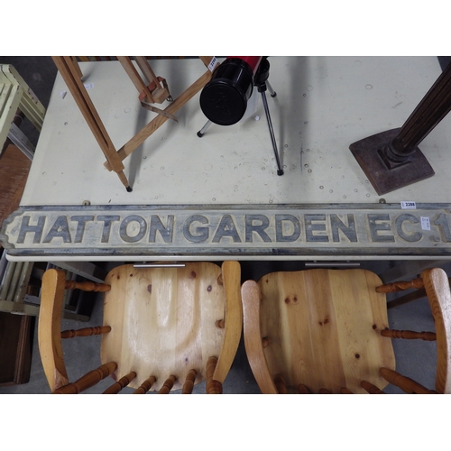 2288 - A reproduction Hatton Garden EC1 street sign, together with a hardwood jardiniere stand (2)