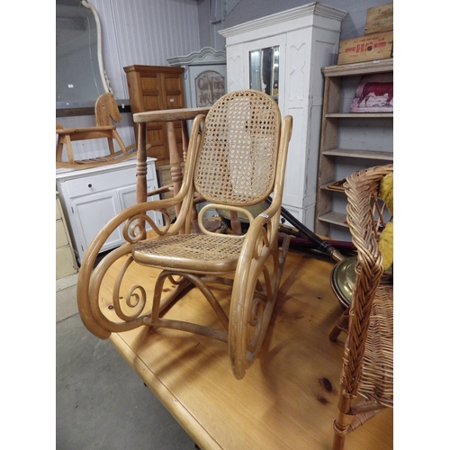 2298 - A Thonet bentwood cane seated rocking chair   (E) £10-15