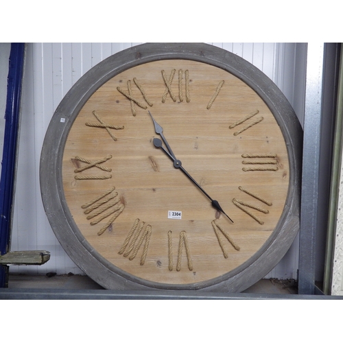 2304 - A modern wood framed wall clock with rope Roman numerals