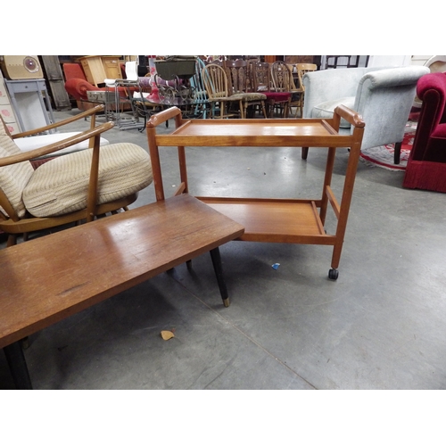 2353 - A teak two tier tea trolley and coffee table