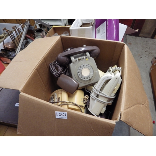 2402 - A box of vintage telephones