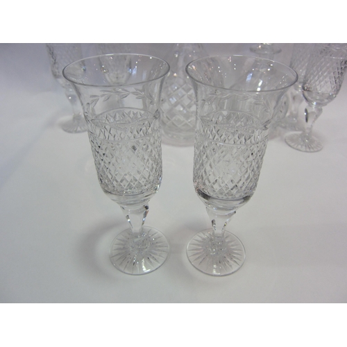 1186 - Six crystal hobnail cut champagne flutes, a similar decanter of bulbous form, 28cm tall and a smalle... 