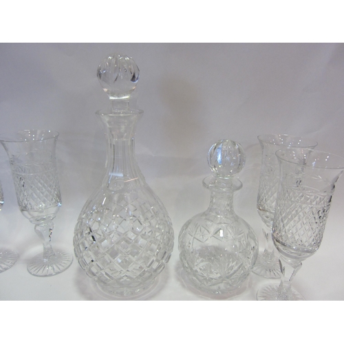 1186 - Six crystal hobnail cut champagne flutes, a similar decanter of bulbous form, 28cm tall and a smalle... 