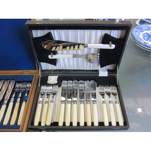 1193 - An oak cased canteen of fish cutlery and one other