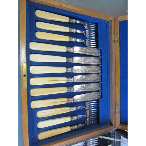 1193 - An oak cased canteen of fish cutlery and one other