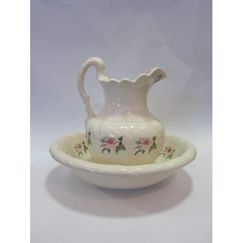 1200 - A floral decorated wash jug and bowl     (E) £10-15