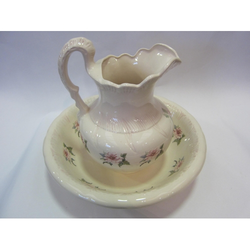 1200 - A floral decorated wash jug and bowl     (E) £10-15