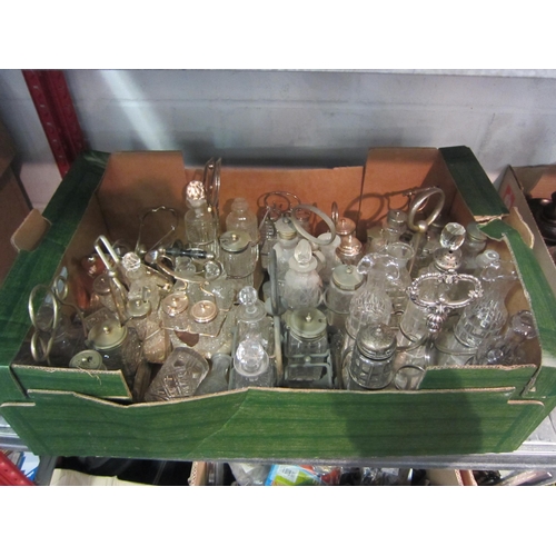 1230 - A collection of plated and cut glass cruet sets and a plated egg cruet