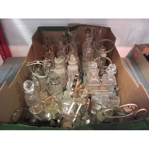 1230 - A collection of plated and cut glass cruet sets and a plated egg cruet