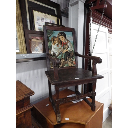 2458 - An 18th Century rustic oak elbow chair with later needle point back panel   (E) £20-30