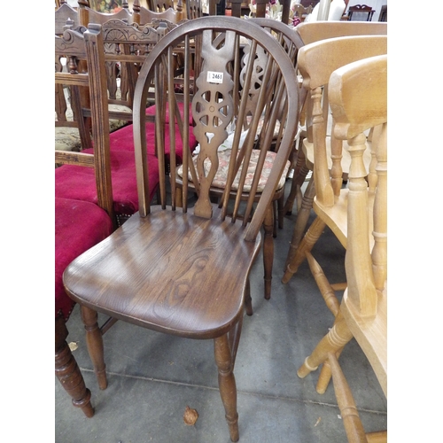 2461 - Three oak wheel back kitchen chairs