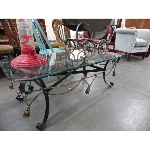 2477 - A wrought iron coffee table with glass top   (R) £20