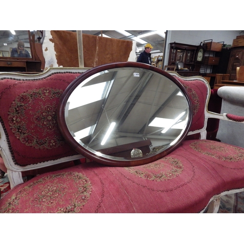 2479 - An oval bevelled edge mirror and oak side table