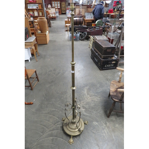 2024 - A Victorian brass height adjustable standard lamp