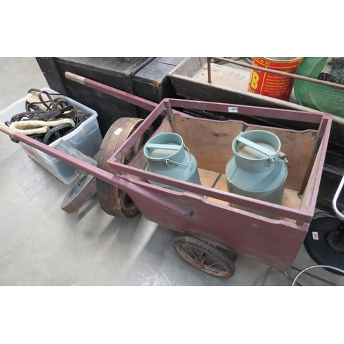 2050 - A French wheelbarrow with two milk jugs   (E) £40-60