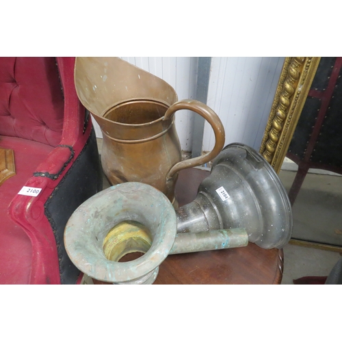 2104 - A large copper jug and two funnels