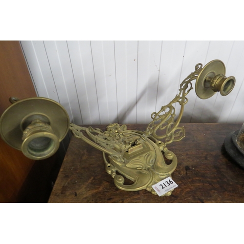 2136 - A pair of brass candle sconces