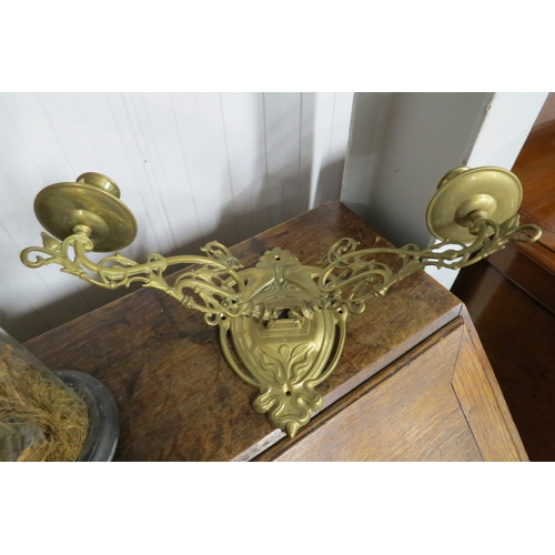 2136 - A pair of brass candle sconces