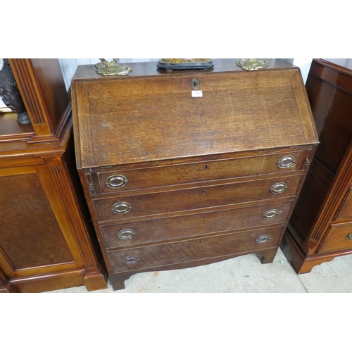 2137 - A Georgian oak four drawer bureau