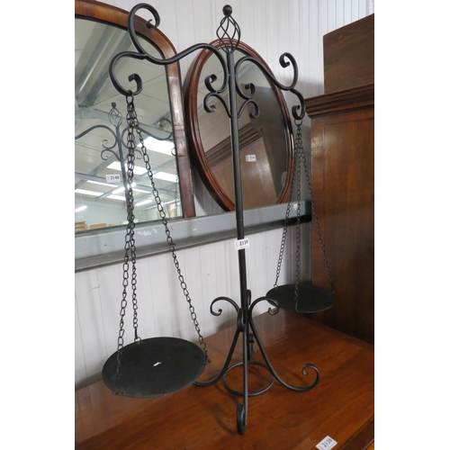 2139 - A decorative wrought iron set of balance scales