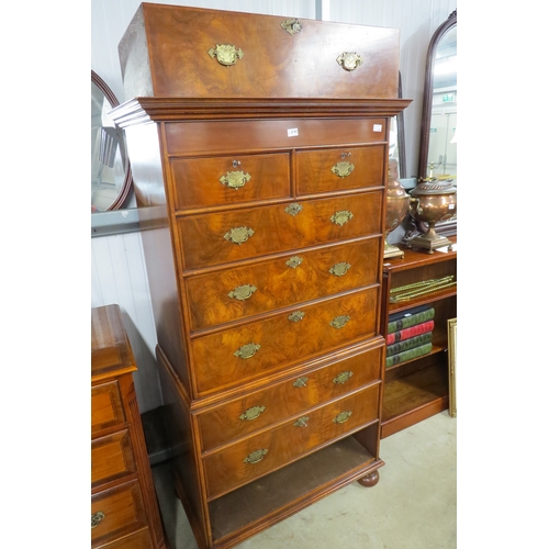 2142 - A Queen Anne revival walnut chest on chest with brass handles and bun feet