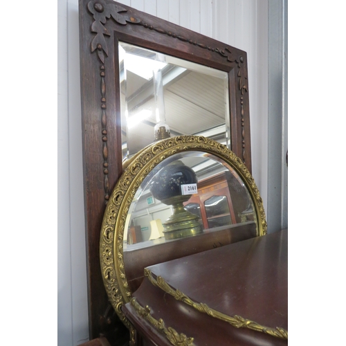 2161 - A circular gilt framed mirror and an oak mirror