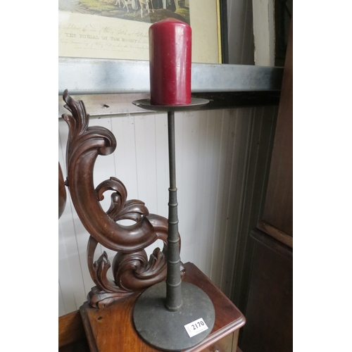 2170 - A cast iron candlestick and a painted wooden candlestick   (R) £25